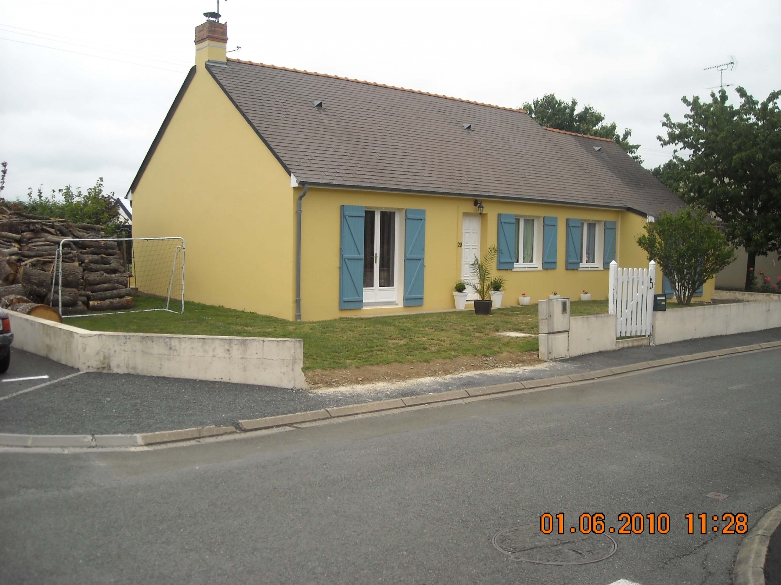 Rénovation façade jaune maison